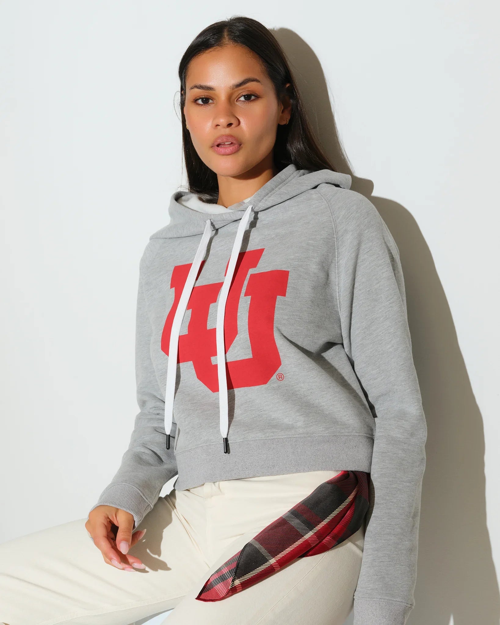 Heather grey Utah Utes cropped hoodie with a bold red interlocking U logo on the chest, drawstring hood, and a relaxed fit.