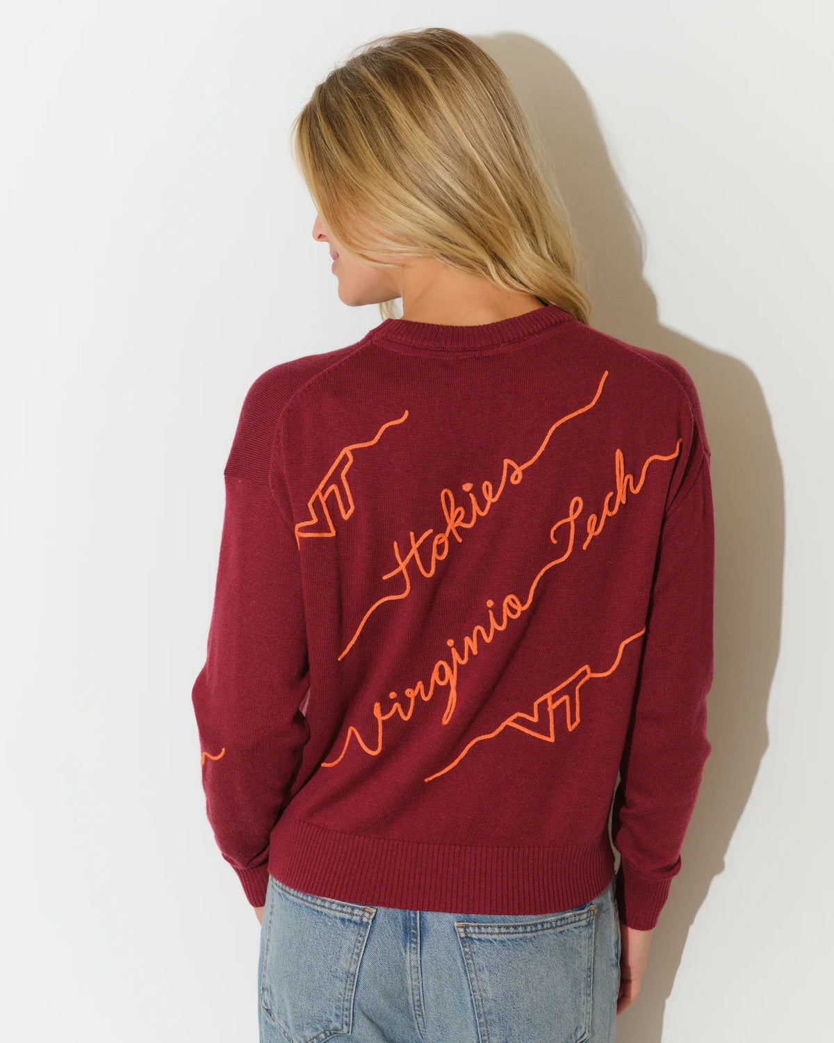 Maroon Virginia Tech crewneck sweater with diagonal orange script "Hokies," "Virginia Tech," and "VT" lettering across the front.