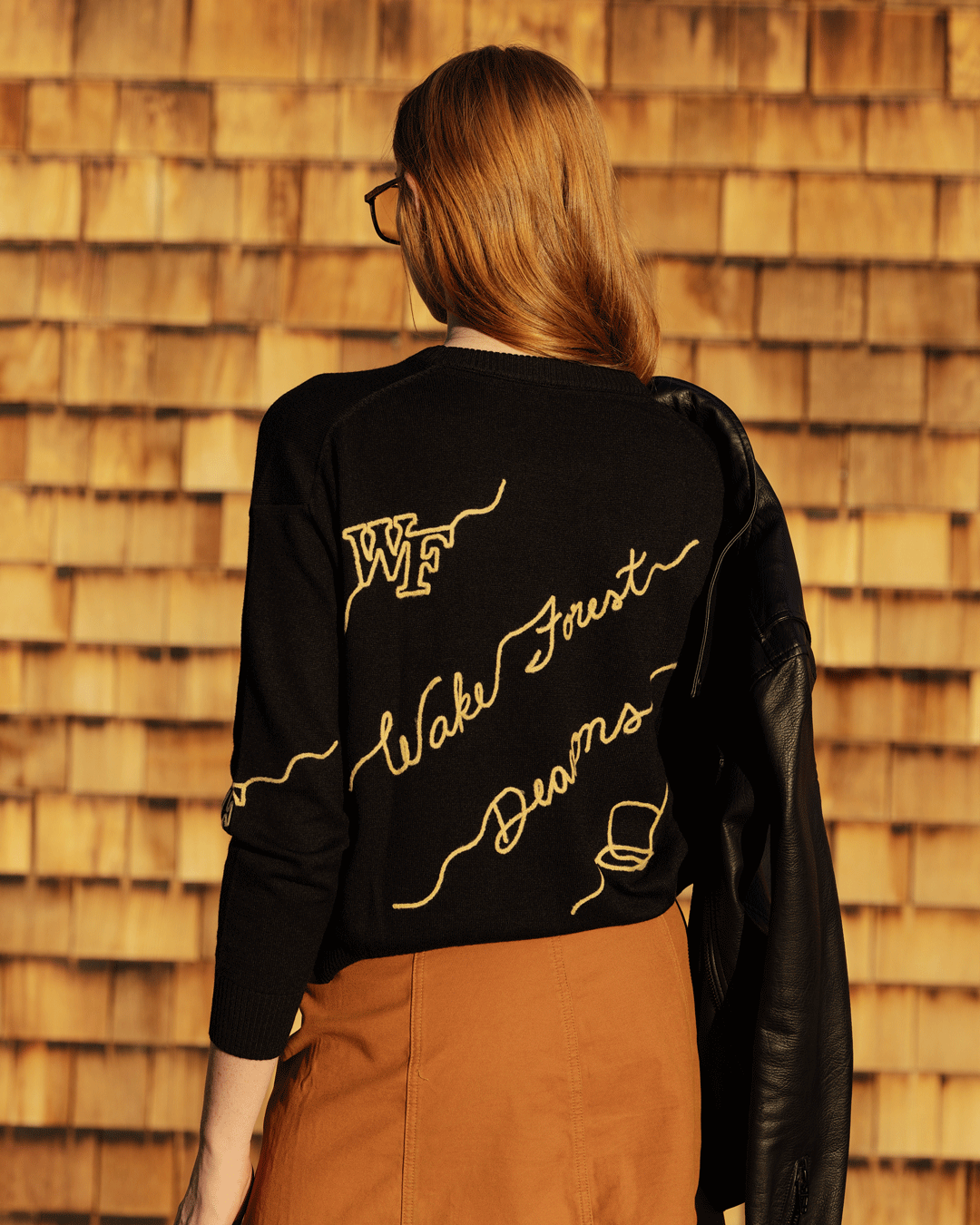 Black long sleeve love letter sweater with wake forest demon deacons embroidery, perfect for school pride and tailgates.