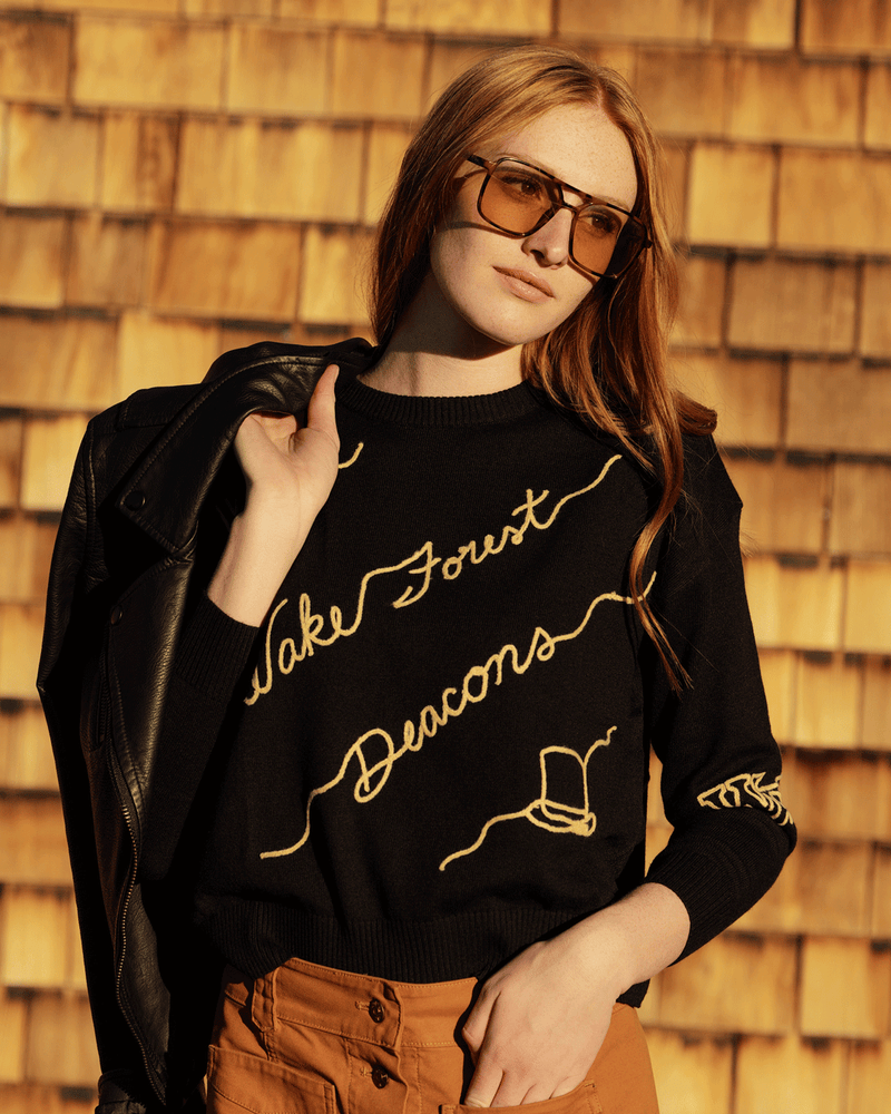 Black long sleeve love letter sweater with wake forest demon deacons embroidery, perfect for school pride and tailgates.