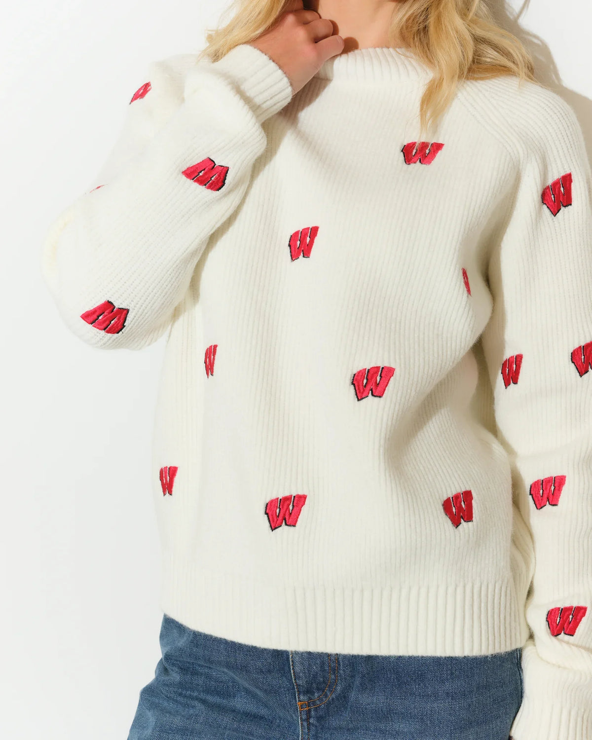 Ivory Wisconsin Badgers fisherman sweater with allover red Badger logo pattern, featuring a relaxed fit and ribbed cuffs.