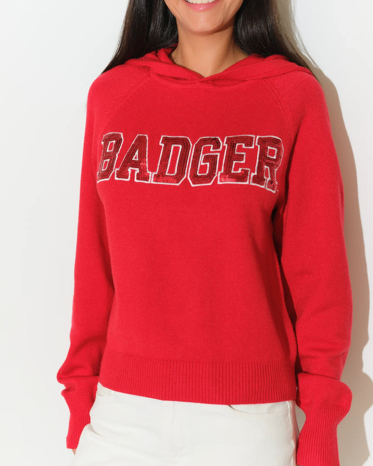 Red Wisconsin Badgers pullover hoodie with bold chenille "BADGERS" lettering across the chest, featuring a relaxed fit and front kangaroo pocket.