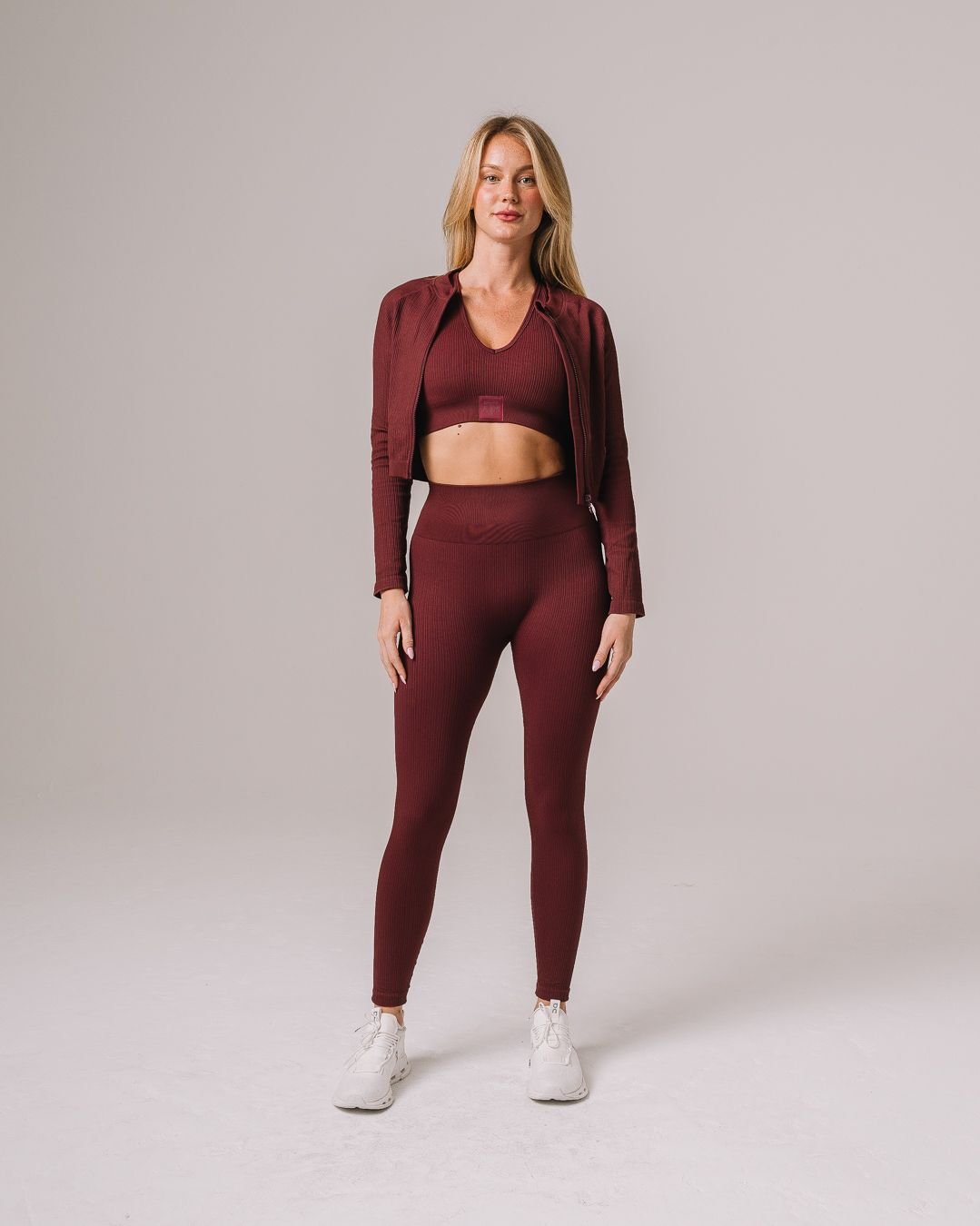 Maroon seamless leggings with Texas A&M Aggies patch, styled for workouts or gym.