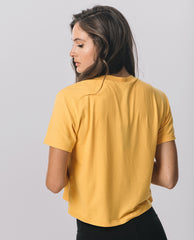 Back view of KADYLUXE® Milky Silk™ Crop Tee in Golden Yellow