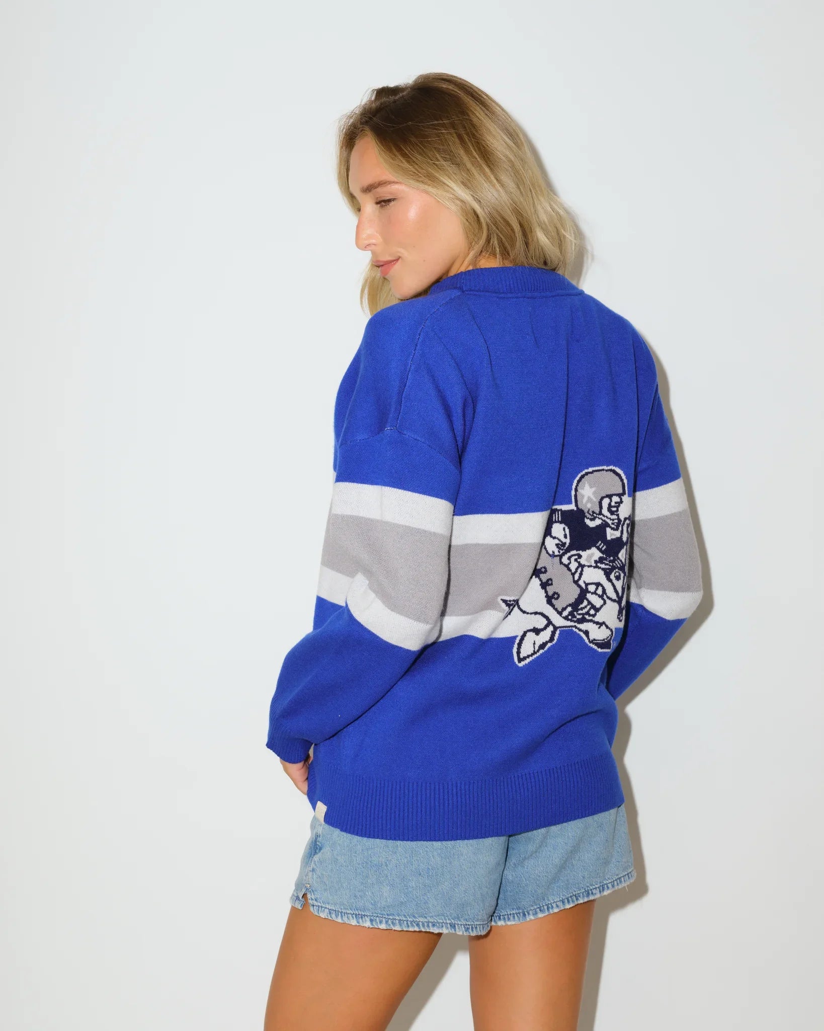 Royal, gold, and white colorblock Dallas Cowboys Vinti Cardi with a V-neckline and embroidered vintage helmet logo on the chest.