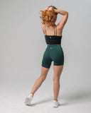 Back view of KADYLUXE® Michigan State Spartans® Biker Short in Forest Green