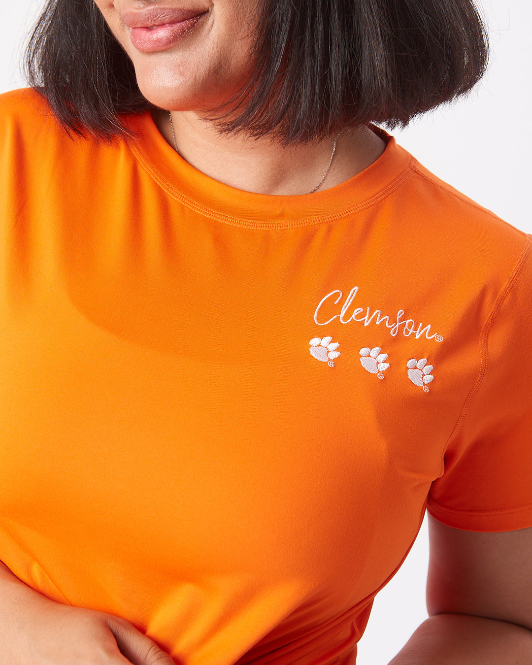 KADYLUXE® Clemson Tigers womens Milky Silk™ crop tee in color orange with white embroidery on left chest.
