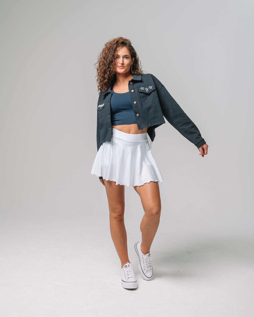 Navy rhinestone jacket with Dallas Cowboys logo, ideal for tailgates, city streets, or game day flair.