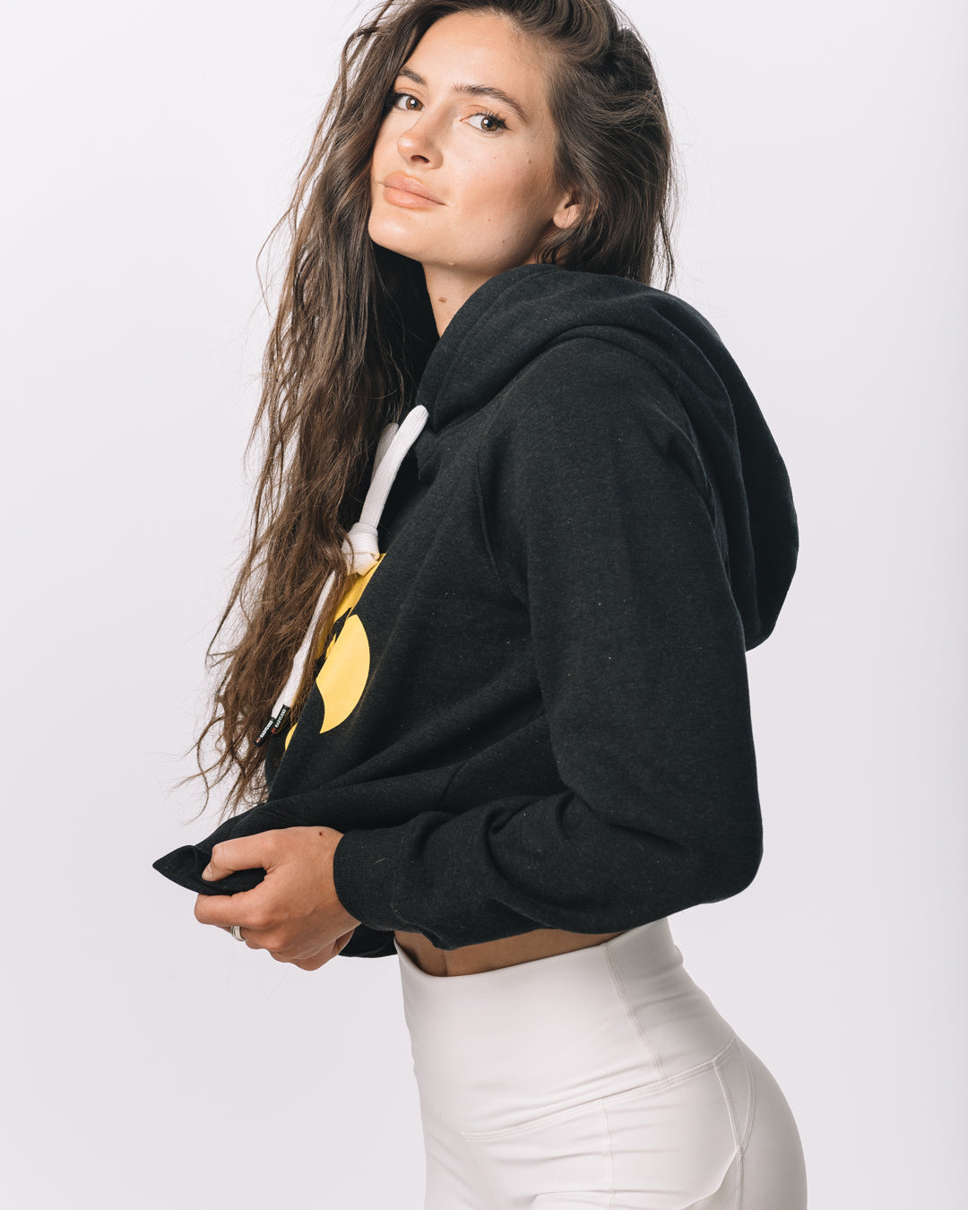 Side view of KADYLUXE® Iowa Hawkeyes® Cozy Crop Hoodie in Black