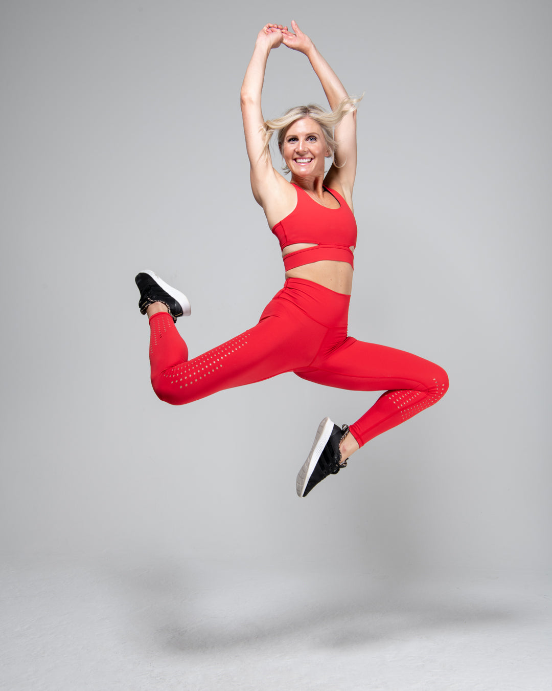 kadyluxe-womens-activewear-legging-red-laser-punch-out-holes