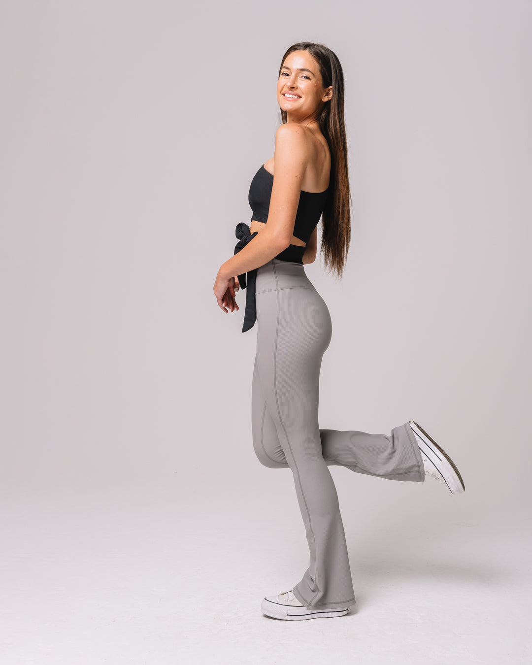 Side view of KADYLUXE® Regal Rib Flare Pant in Cement Rib