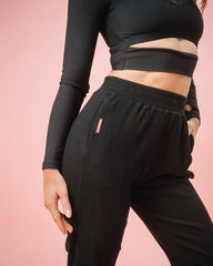 KADYLUXE® womens rib sweat pant in black color close up view of rose gold hardware