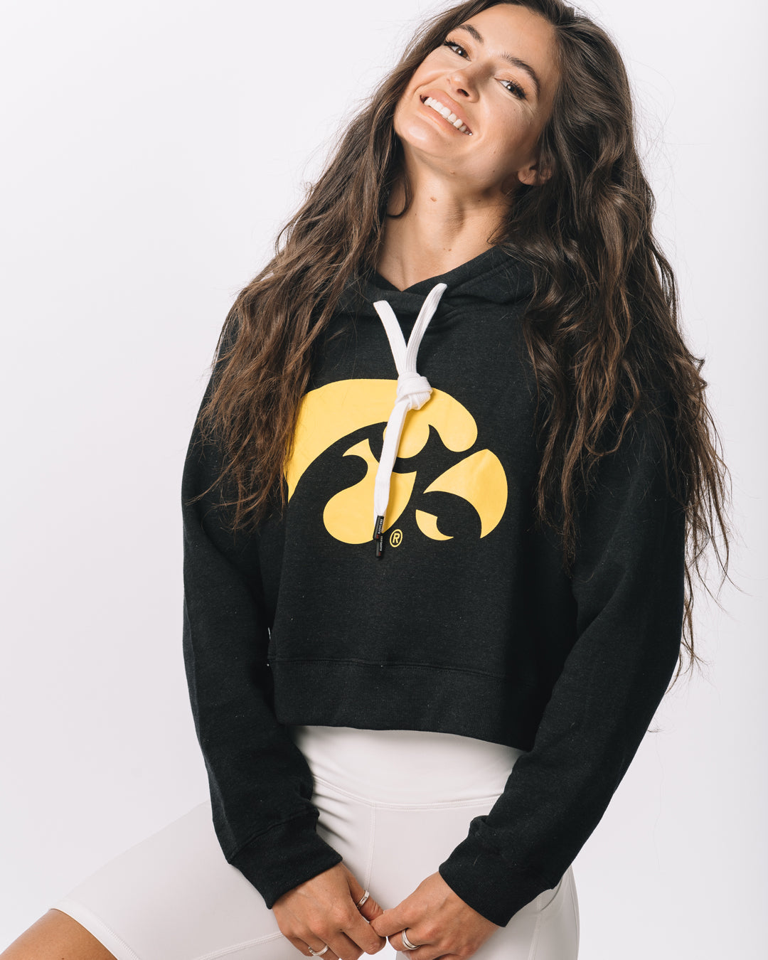 Front view of KADYLUXE® Iowa Hawkeyes® Cozy Crop Hoodie in Black