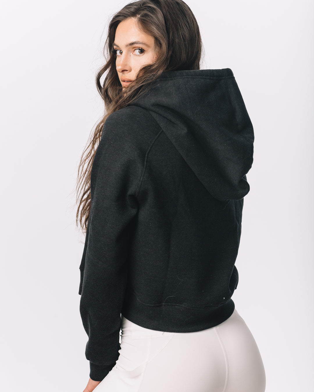 Back view of KADYLUXE® Iowa Hawkeyes® Cozy Crop Hoodie in Black