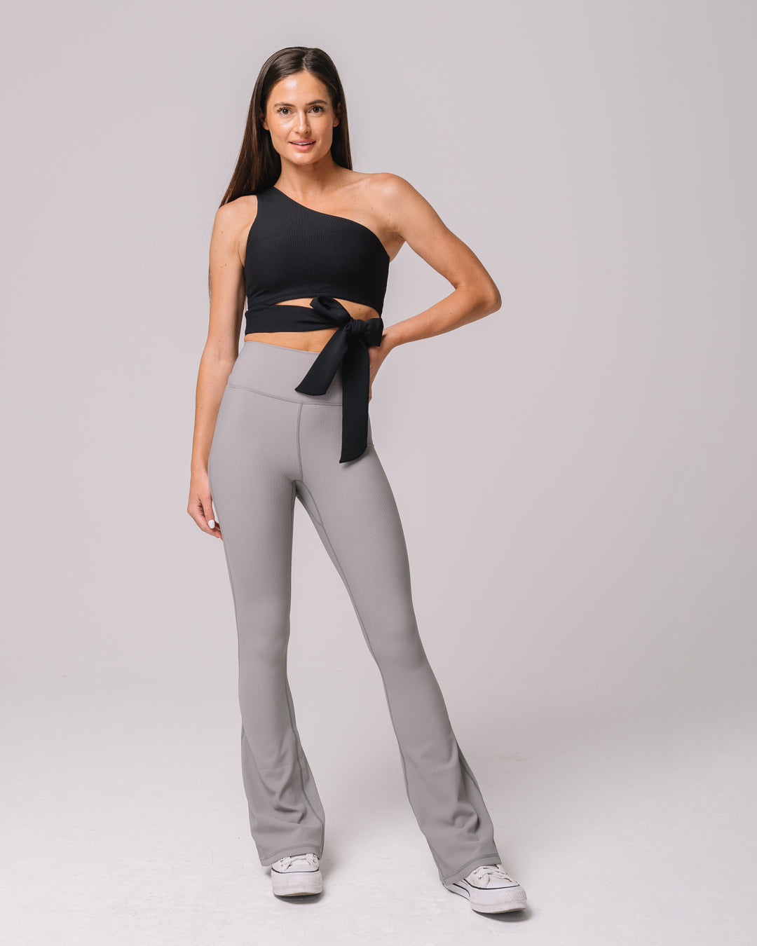 Front view of KADYLUXE® Regal Rib Flare Pant in Cement Rib