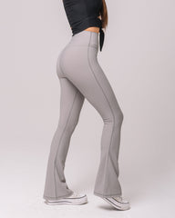 Side view of KADYLUXE® Regal Rib Flare Pant in Cement Rib