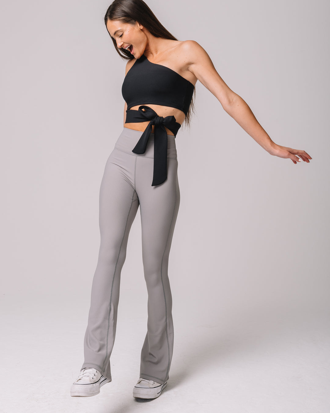 Front view of KADYLUXE® Regal Rib Flare Pant in Cement Rib