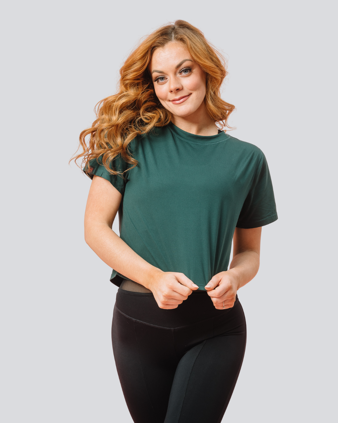 Front view of KADYLUXE® Milky Silk™ Crop Tee in Forest Green