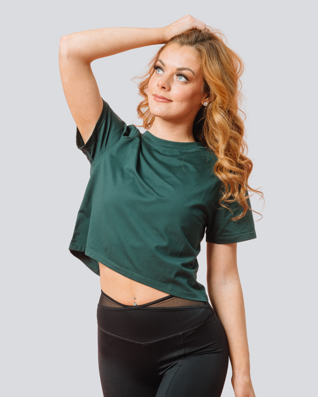 Front view of KADYLUXE® Milky Silk™ Crop Tee in Forest Green