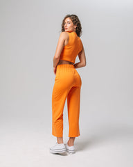 Back view of KADYLUXE® Milky Silk™ Resort Pant in Electric Mandarin