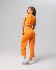 Back view of KADYLUXE® Milky Silk™ Resort Pant in Electric Mandarin