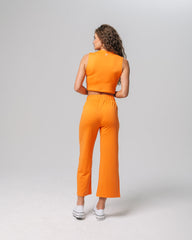 Back view of KADYLUXE® Milky Silk™ Resort Pant in Electric Mandarin