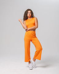 Front view of KADYLUXE® Milky Silk™ Resort Pant in Electric Mandarin