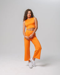 Front view of KADYLUXE® Milky Silk™ Resort Pant in Electric Mandarin