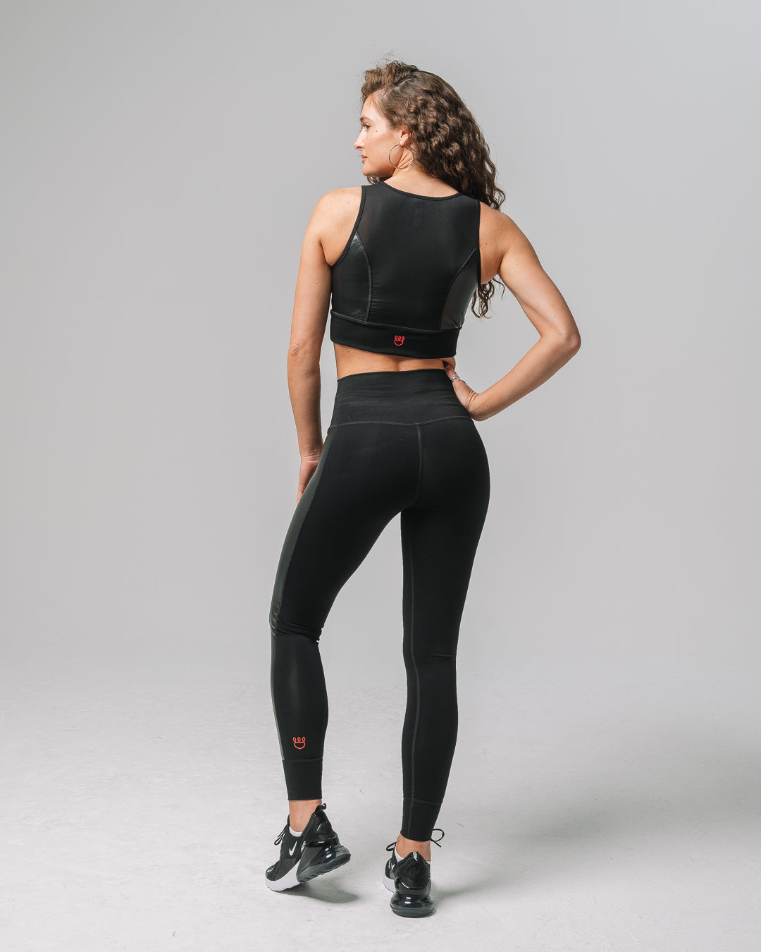 KADYLUXE® recycled faux leather legging in color black back view