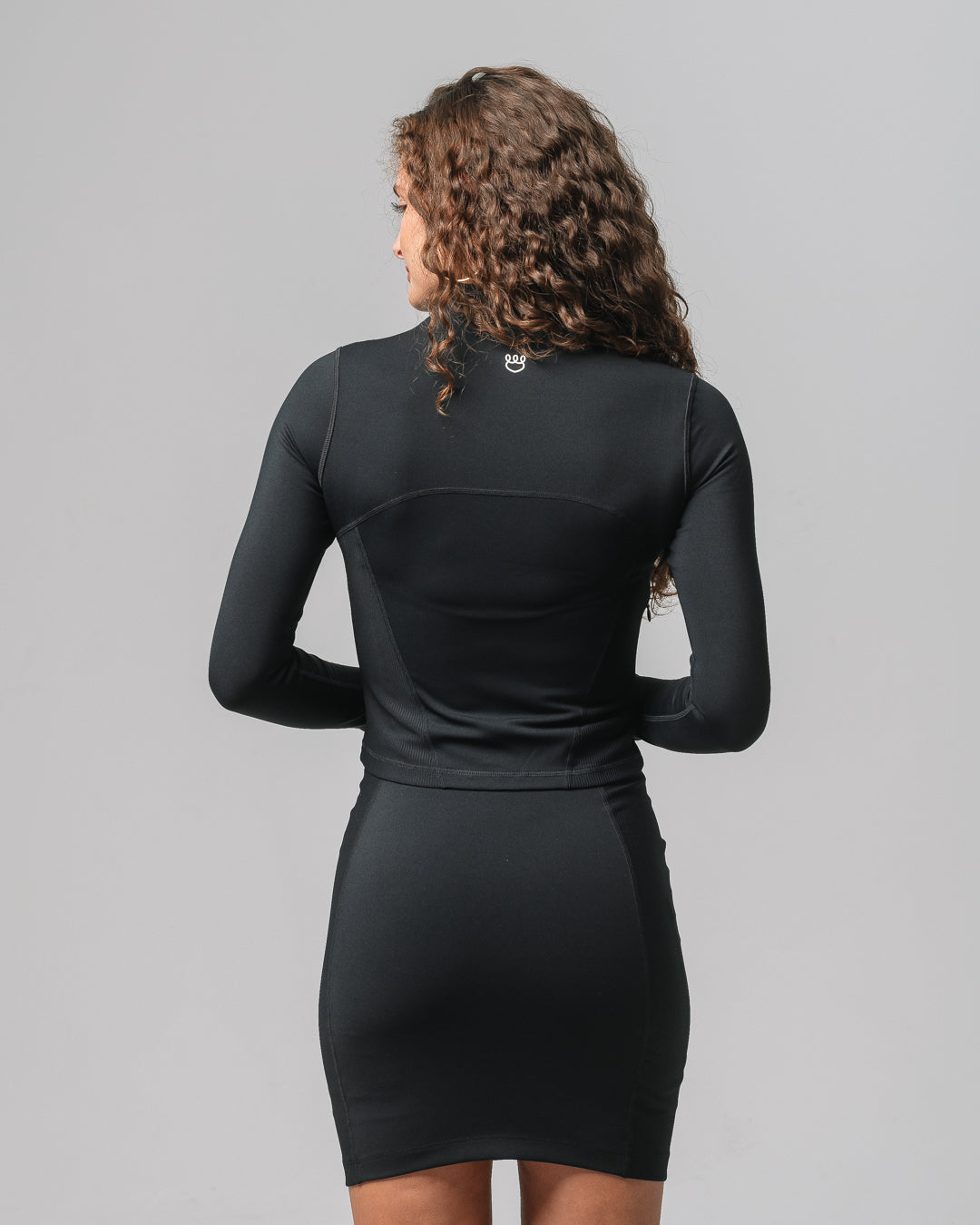 Back view of KADYLUXE® Midi Sports Jacket in Black